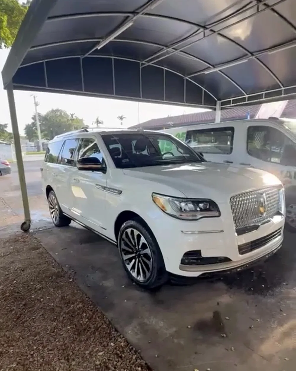White Lincoln Navigator SUV gleaming after professional detailing at Michael's Detailing Car Wash